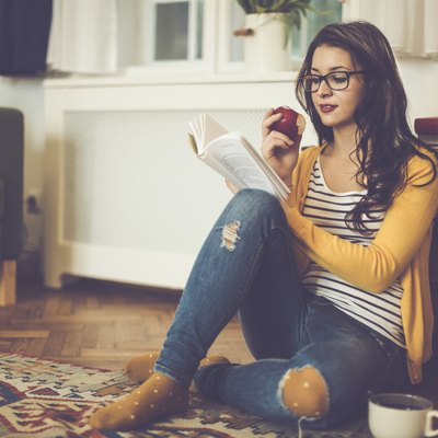 Young woman reading a book
