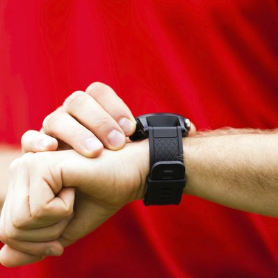 Runner looking at sport watch