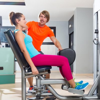 A woman is strength training.