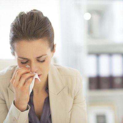 A young businesswoman, allergies