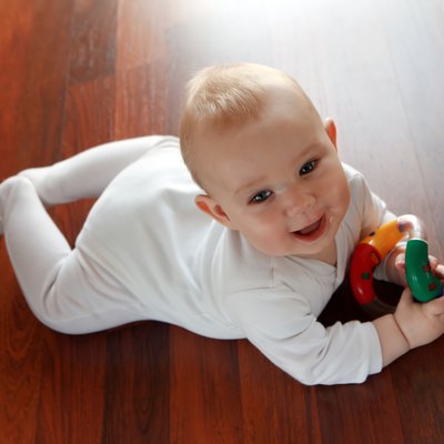 Baby boy with his first toys