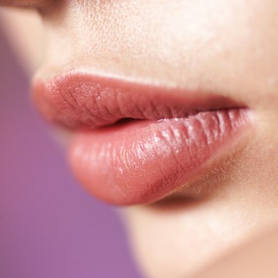 a close up shot of the full lips of a young caucasian girl