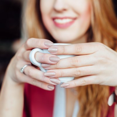 Woman drinking coffee in a cafe