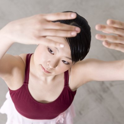 Ballerina posing on floor