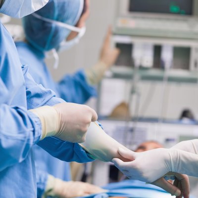 Doctor removing his gloves