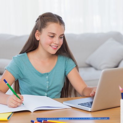 Little girl doing her homework at home