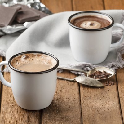 Hot chocolate with foam in two mugs