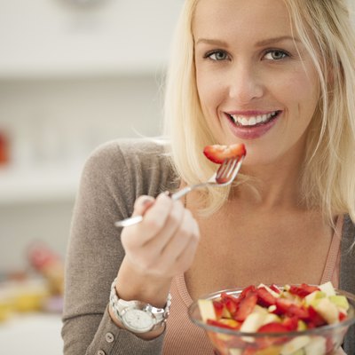 Woman Eating a Fruit Salad