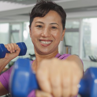 Woman exercising with weights