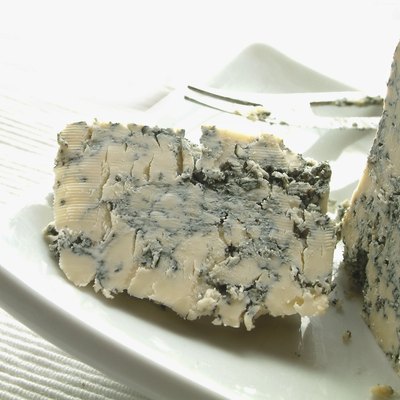 stilton cheese on white platter