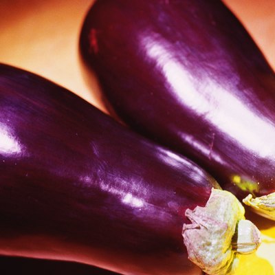 Two whole eggplants