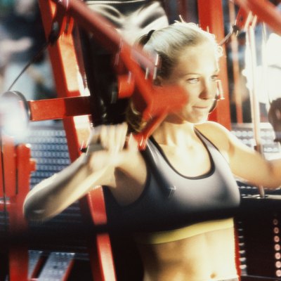 Close-up of a young woman exercising in a gym