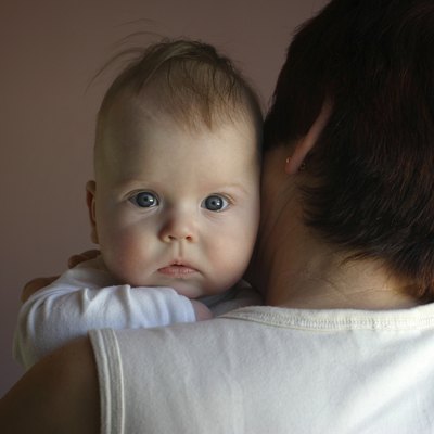 grandmother holding baby girl