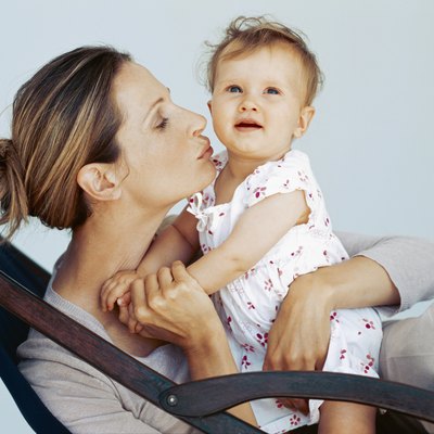 close-up of a mother kissing her son