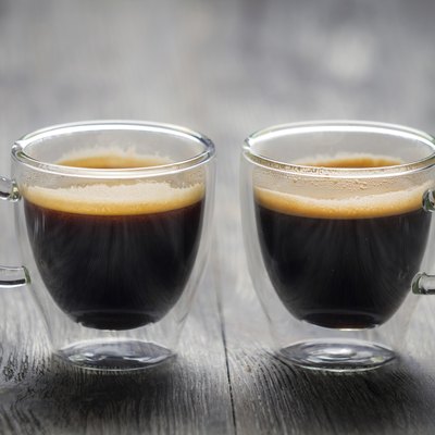 Closeup of two small cups with espresso