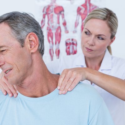 Doctor stretching her patient neck
