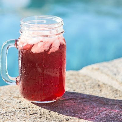Old fashioned drink on ice by the pool
