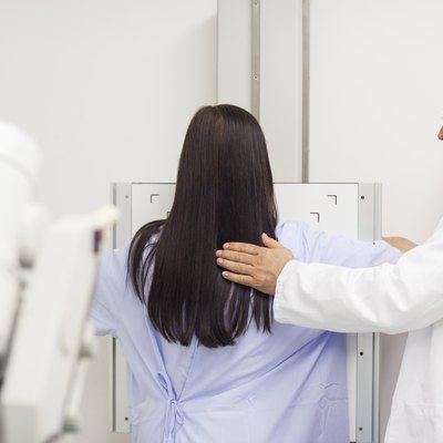 Doctor doing a mammography on a patient