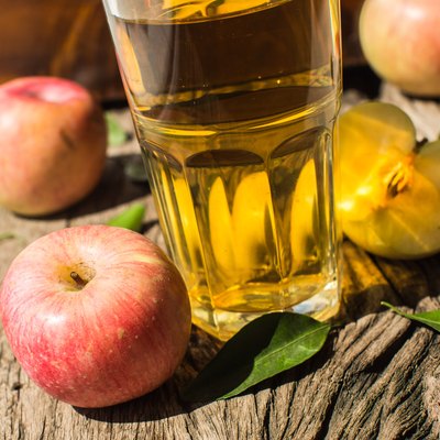 Apple juice on a wooden board