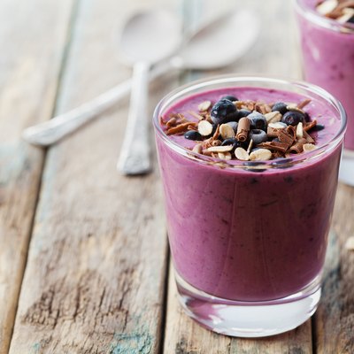Smoothie, yogurt, milkshake with frozen berry, oats decorated grated chocolate