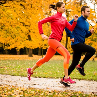 Couple jogging in autumn nature