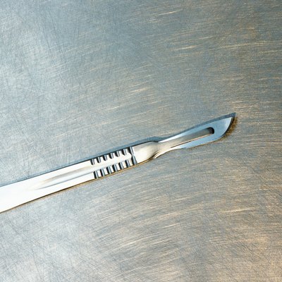 a clean scalpel lying on a table