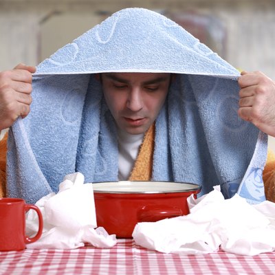 Man inhaling warm steam