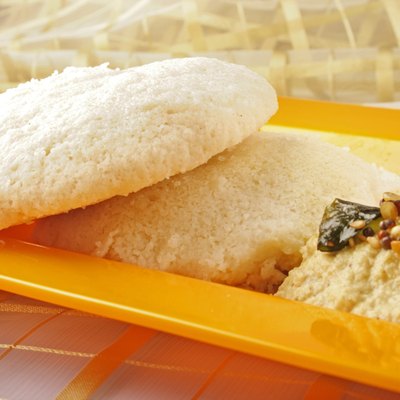 Idly served in a plate with chutney