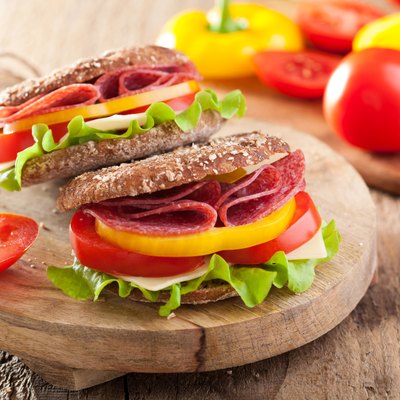 healthy sandwich with salami tomato pepper and lettuce