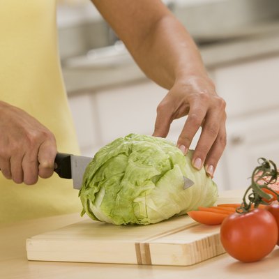 Woman cutting lettuce