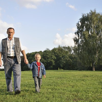 grandfather and boy walking