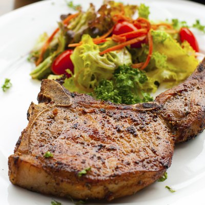 Pork chop with salad close up
