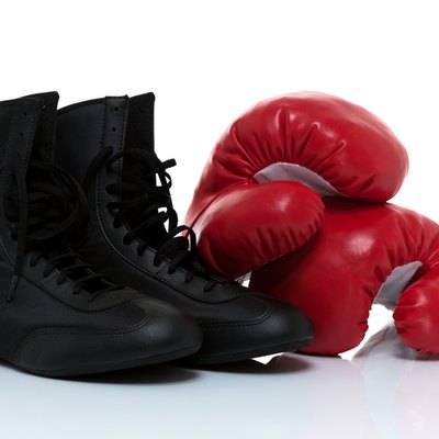 Boxing gloves and shoes isolated on white