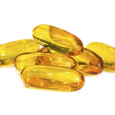 Fish oil supplement capsules isolated on white background