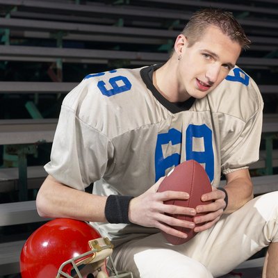 Football player in bleachers