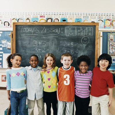 Portrait of Primary Schoolboys and Schoolgirls Standing in a Line in a Classroom