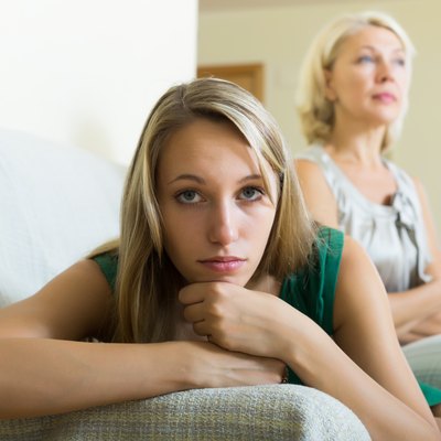 Upset woman and mother having conflict