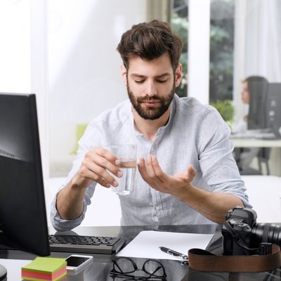 Young businessman has a pain