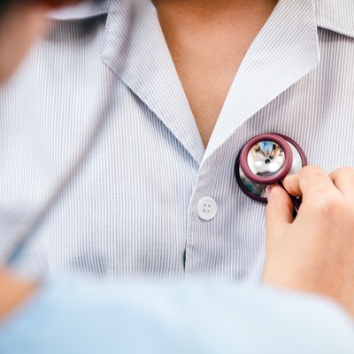 doctor listening to patient’s heart