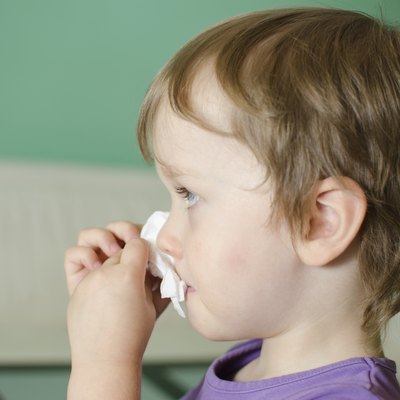 Boy cleaning his nose