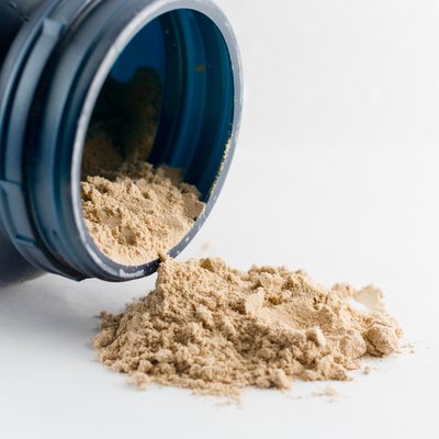 Whey protein chocolate powder isolated on white background.