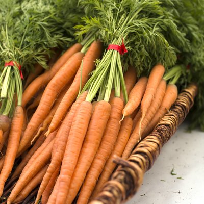 carrots in a basket on white table at farmers market