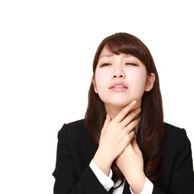 businesswoman having throat pain