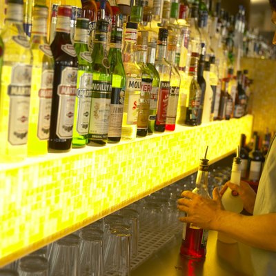 "Man working in bar, facing optics"