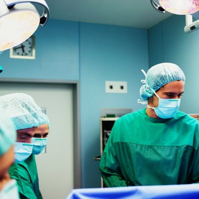 Operating theatre team tending to patient