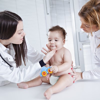 Pediatrician doing checkup on baby