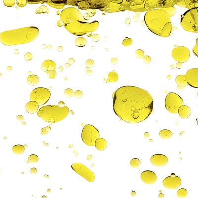 Olive Oil Drops Isolated on White