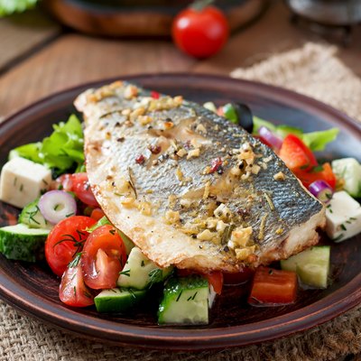 Baked seabass with Greek salad