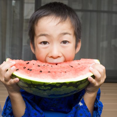 Boy Biting Watermelon