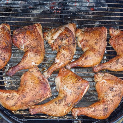 Chicken legs on a charcoal grill